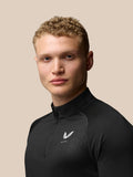 Three quarter back view of black Adapt Training top with Aertek branding at the lower back hem.