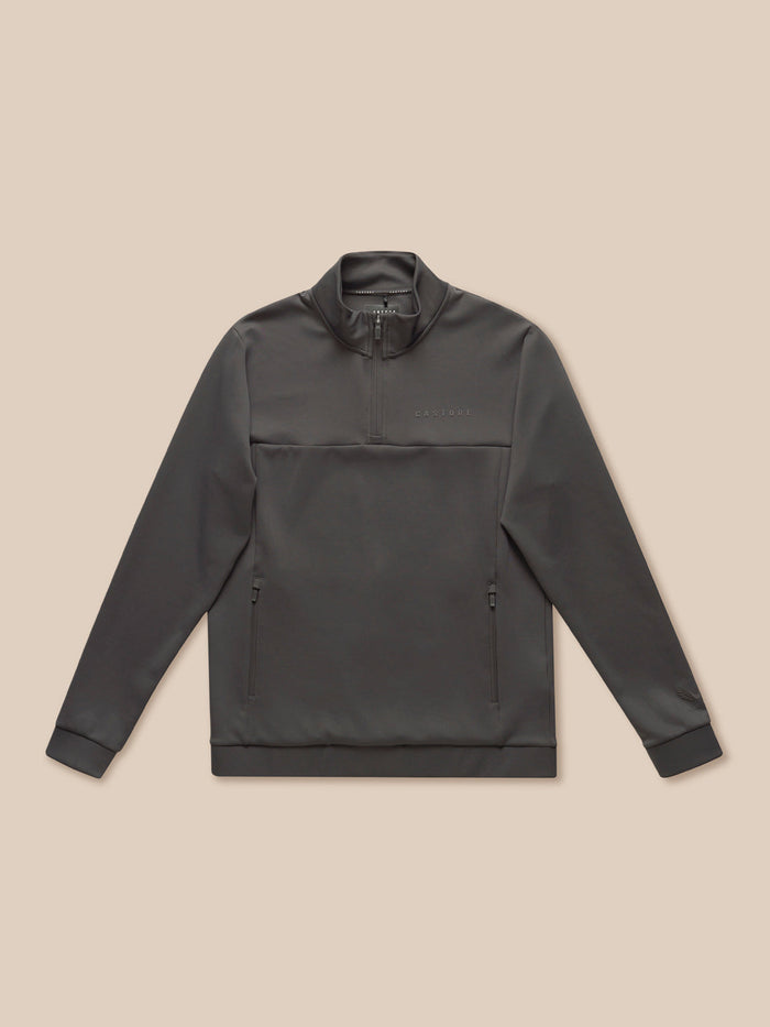 Front view of a charcoal Flex Quarter Zip top laid flat with zip pockets and chest branding