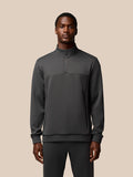 Male model wearing charcoal Castore Flex Lifestyle 1/4 Zip top front view