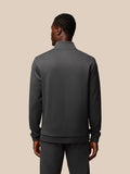 Back view of male model in charcoal Castore Flex Lifestyle 1/4 Zip top