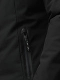 Close up of zipper detail on black longline jacket showing Castore branding