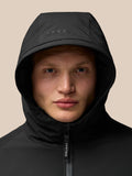 Close up of a model wearing a black longline hooded jacket featuring ProTek water-resistant fabric.