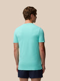 Back view of male model wearing light aqua Zone Training T-Shirt highlighting ribbed back panel