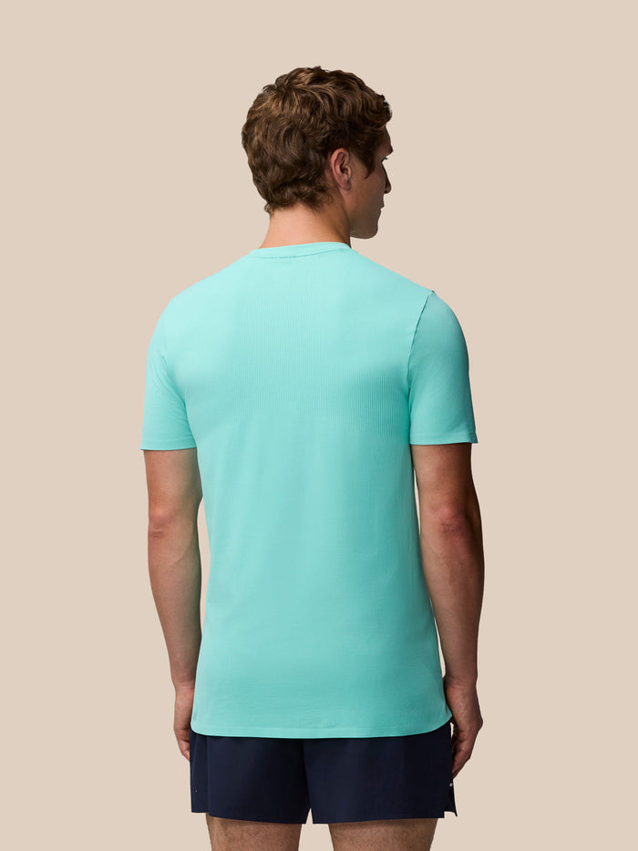 Back view of male model wearing light aqua Zone Training T-Shirt highlighting ribbed back panel