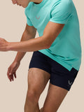 Close-up of light aqua Zone Training T-Shirt on model showing subtle chest logo and smooth fabric