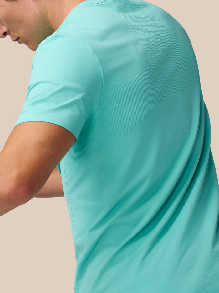 Back view of Zone Training T-Shirt in light aqua showing ribbed panels and bonded hems