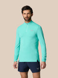 Model wearing light aqua Zone Training 1/4 Zip Top with high neck and chest logo