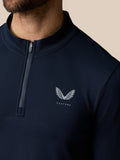 Close-up of navy Zone Training top collar with half zip and Castore logo on the chest.
