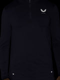 Close up of a dark Zone Training 1/4 Zip Top with a small white crest on the chest and zip at the neck