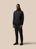Rear view of male model in black Flex Winterised Woven Joggers with textured lower legs