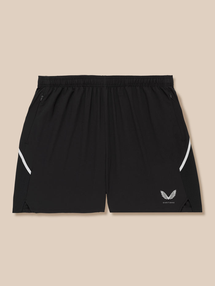 Waistband close up of black Apex shorts with zip pockets and Castore logo near the hem
