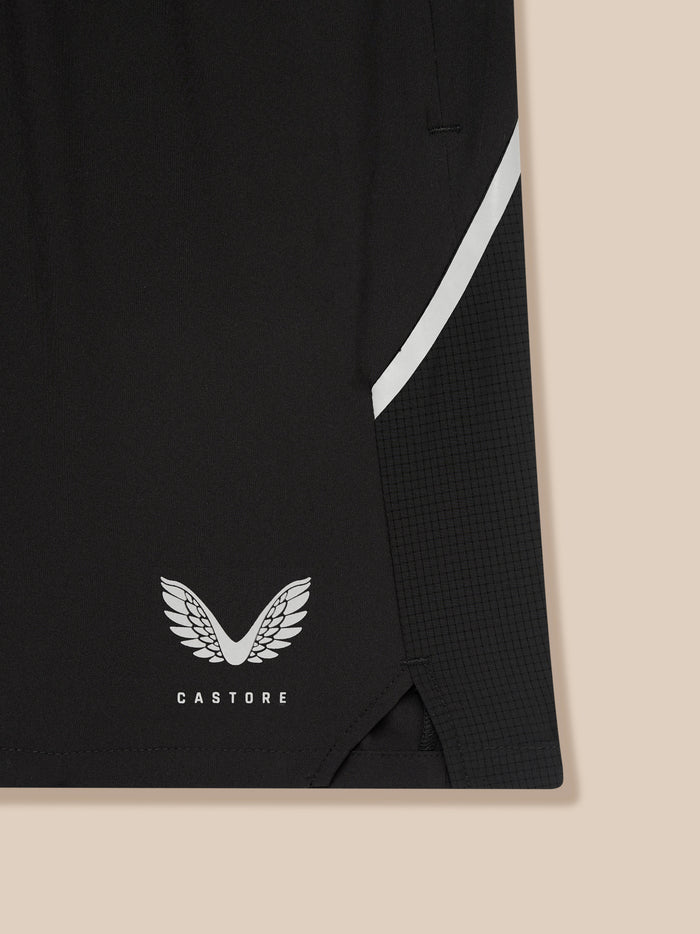 Side view of black Apex shorts highlighting the white curved side stripe and Castore branding