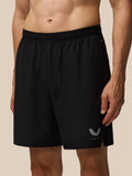 Back view of black Apex 6 Inch Shorts with elastic waistband zip pocket and logo on the left leg