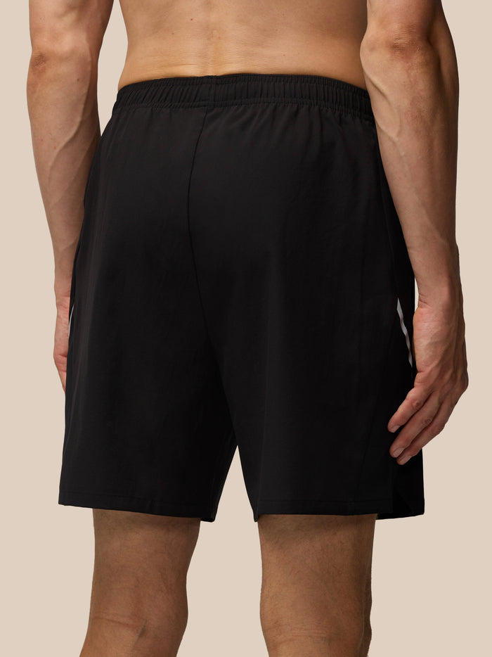 Close up of black Apex 6 Inch Shorts showing Castore logo near the hem