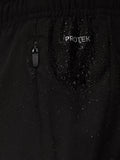 Macro shot of black ProTek fabric with zipper and scattered water droplets