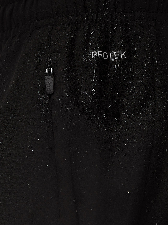 Macro shot of black ProTek fabric with zipper and scattered water droplets