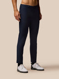 Midnight navy Golf Club Trousers worn with white golf shoes on a model