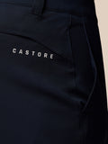 Close-up of midnight navy golf trousers showing back pocket with Castore branding.