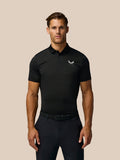 Man wearing black Golf Pinnacle Pique Stripe Polo with tonal stripes and Castore branding on chest