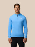 Male model wearing cool blue Golf Club Classic quarter zip top with funnel collar and chest logo