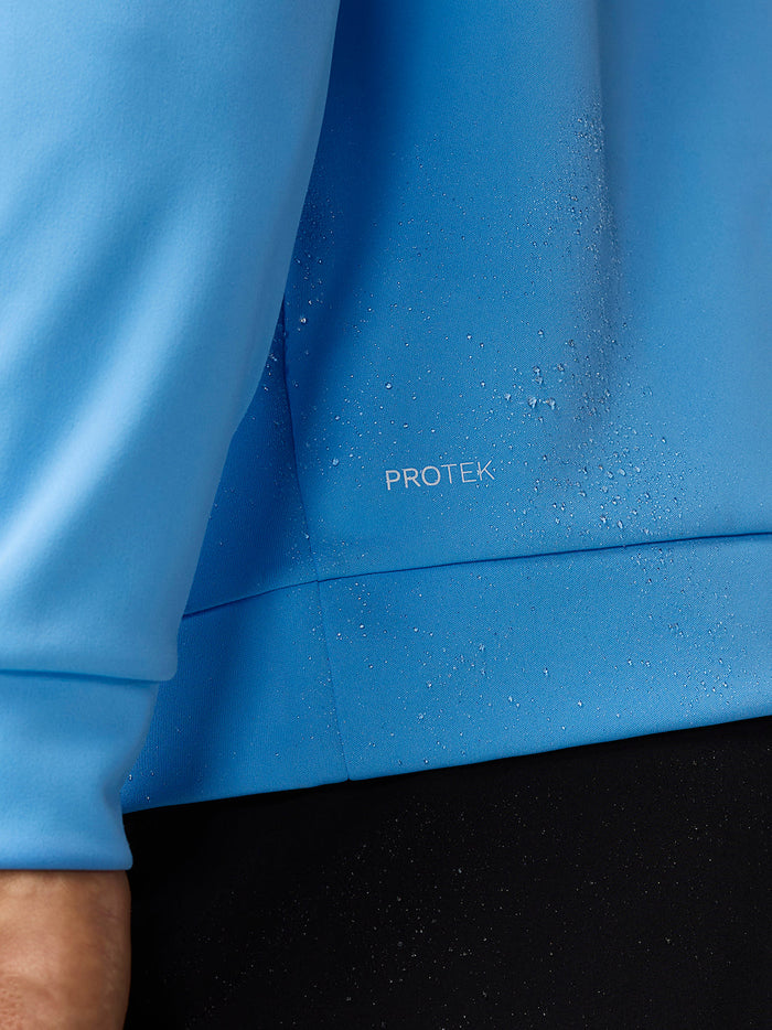 Close-up of blue ProTek water resistant fabric with water droplets on the Golf Club Classic top
