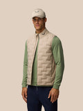 Mushroom Golf Pinnacle gilet with quilted front and ProTek finish worn by a model on a neutral backdrop.