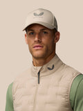 Man wearing Mushroom Golf Pinnacle Gilet with funnel collar and full zip against a neutral background