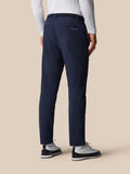 Back view of navy Golf Pinnacle Winter trousers showing a rear pocket with Castore branding and a belt.