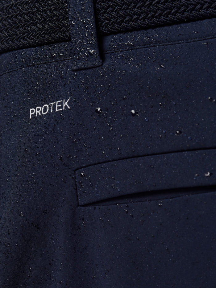 Close-up of navy ProTek fabric with water droplets near the back pocket