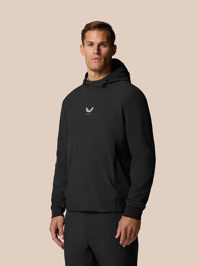 Man in black Golf Pinnacle Performance Hoodie with chest logo.