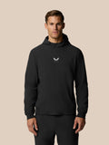 Front view of a man in a black Golf Pinnacle Performance Hoodie with a centered chest logo