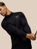 Close-up side view of male model wearing black Golf Club Classic 1/4 Zip Debossed Top with zip detail