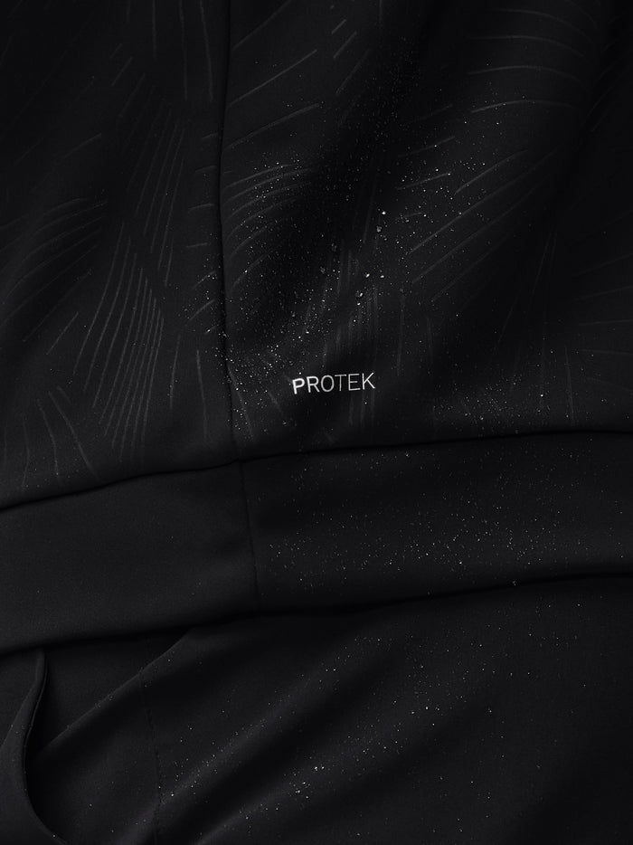 Close up of black fabric with diagonal embossed lines and a ProTek label