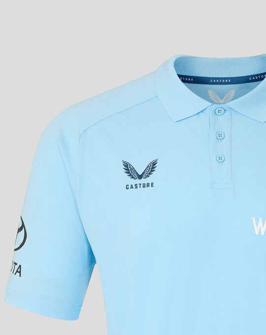 Light blue Travel Polo close up showing collar and Castore crest on the chest.