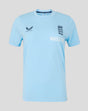 Light blue travel T shirt with navy crest on the chest and Whole Earth text on the front