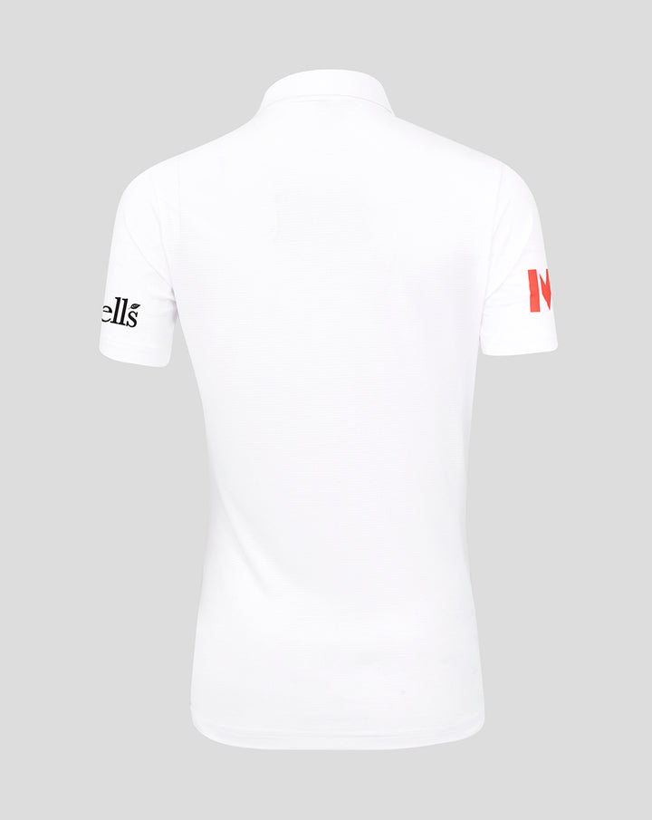 Close up of a white England Test shirt collar showing red placket detail and inner Castore branding.