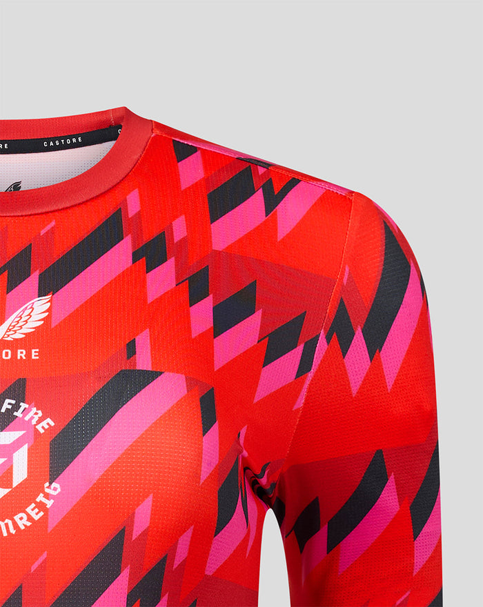 Shoulder and neckline close up of the Welsh Fire training shirt with bold geometric print and Castore branding