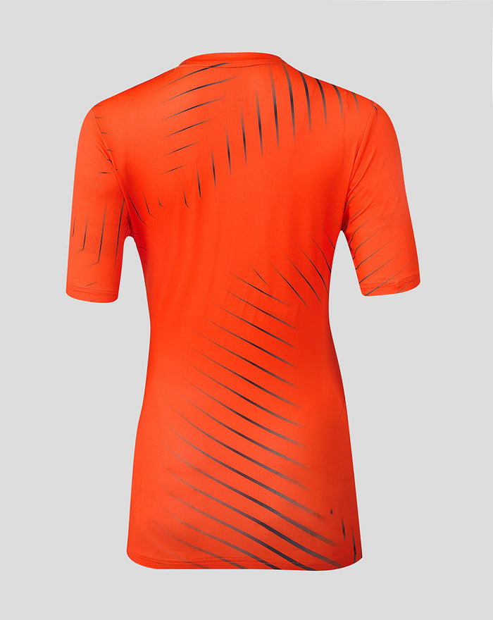 Back view of bright orange Sunrisers Leeds training T shirt with diagonal dark stripes running across the back and sleeves