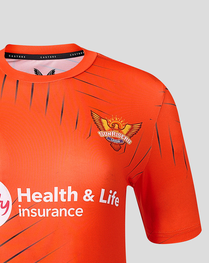 Close up of orange Sunrisers Leeds training T shirt showing crest on the chest and Castore neck label