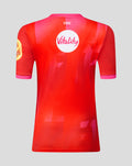 Back view of Welsh Fire 2026 women's short sleeve stretch jersey in red with pink cuffs and Vitality sponsor logo