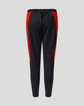 Angled front view of black athletic pants with red side stripe and Welsh Fire branding