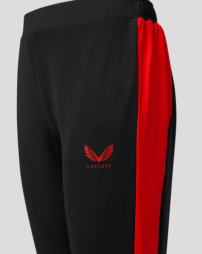 Black junior Welsh Fire pants with red side panel and Castore logo.