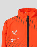 Orange jacket with chest crest and sponsor logos, black zipper down the front and diagonal stripes.