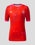 Welsh Fire junior 2026 short sleeve stretch jersey front view red with bold geometric print crest and sponsor logos
