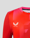 Upper chest of red Welsh Fire jersey with Castore logo and pink shoulder panel