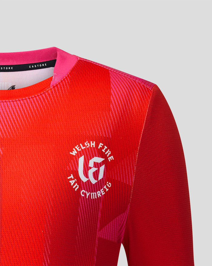 Junior Welsh Fire 2026 short sleeve stretch jersey with bold red geometric print and team crest