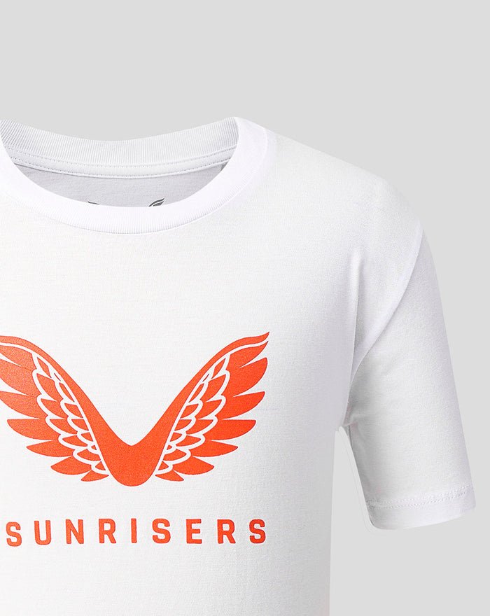 Front view of white juniors T shirt with bold orange wings logo and SUNRISERS text