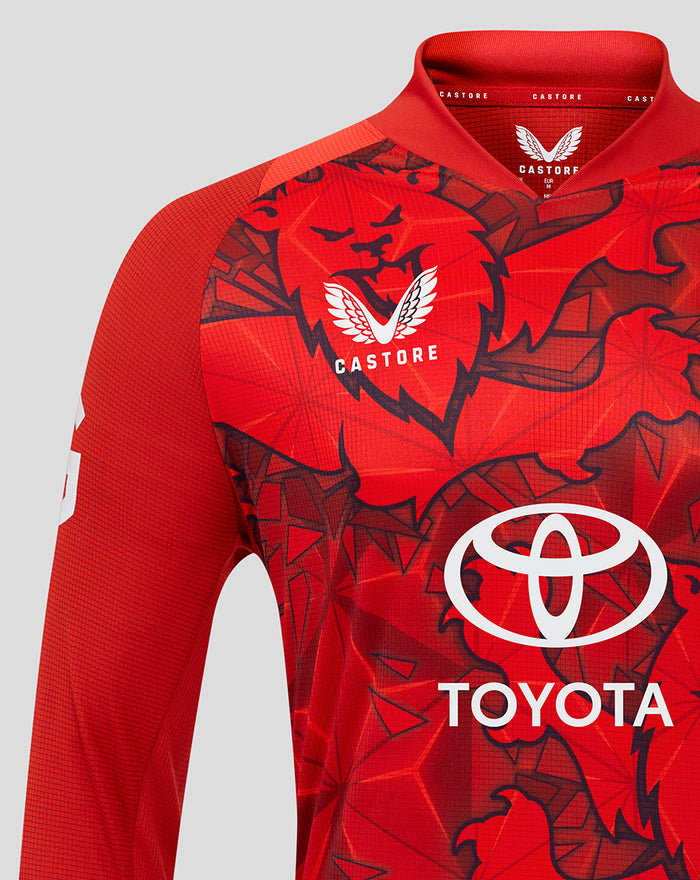 Front close up of red T20 Pro shirt showing bold graphic print and Castore collar detail