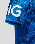 Close up of blue camo sleeve featuring a bold white graphic design.