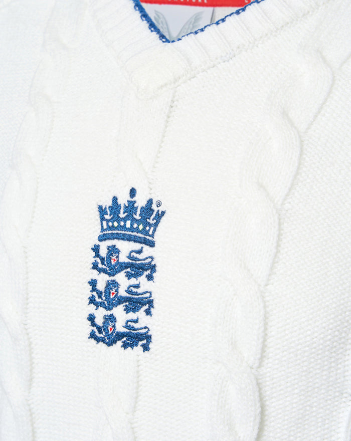White knitted England cricket test sweater with a blue embroidered three lions crest on the chest.